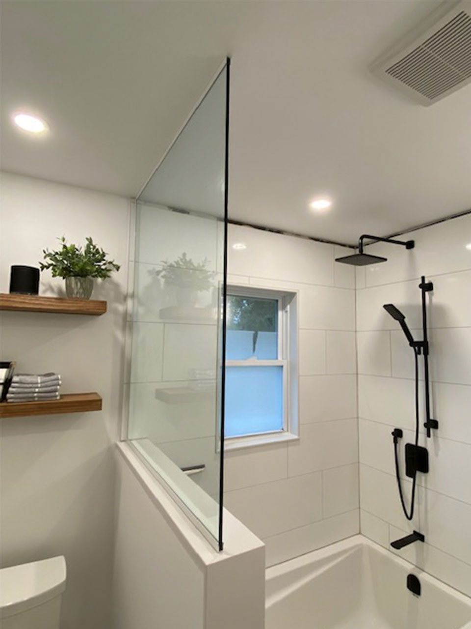 enclosed shower with glass wall