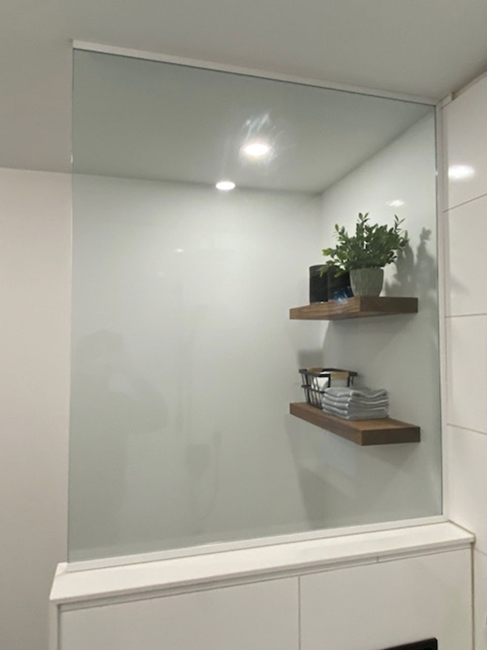 enclosed shower with glass wall