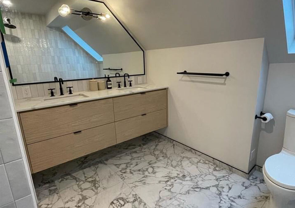 custom-shape bathroom mirror over vanity in residence